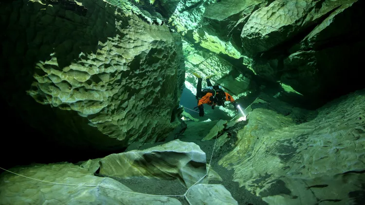 Santala diving the S-curve in Plura Cave. Photo by Pekka Tuuri.